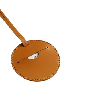 Étiquette de bagage ronde en marron pour valise de voyage, étiquette anti-perte portable.