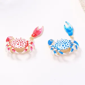 Detailed close-up of cute alloy printed crab brooch, vibrant summer beach vacation jewelry.