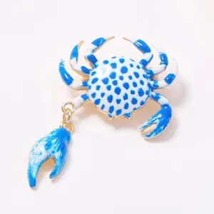 Alloy printed crab brooch detail shot, charming blue and white enamel summer vacation jewelry.