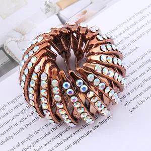 Brown bird nest hair clip with sparkling rhinestones for elegant bun and ponytail styling.
