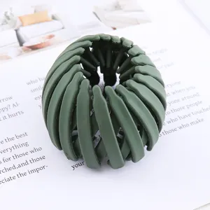 Dark green bird's nest hair clip, lazy bun maker and ponytail holder for daily styling.