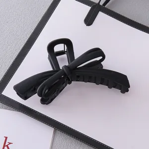 Matte black bow hair claw clip large size elegant hair accessory for women daily styling 1pc