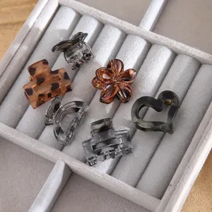 Mini hair claw clips set for women girls, cute matte brown and clear hair accessories.