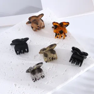 Set of 6 small hair claws, assorted colors and finishes, perfect for bangs and side hair styling.