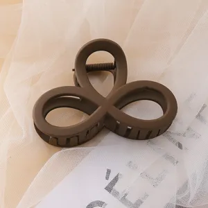 Matte brown hair claw clip large acrylic shark clip elegant minimalist hair accessory detail view