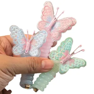 Grazioso elastico per capelli a farfalla per bambini con ricamo dolce e colori vivaci.