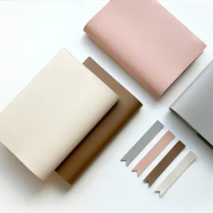 Close-up detail of the soft PU leather notebook cover showing neat stitching and smooth texture.