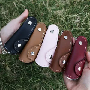 Portable leather shoe horn keychain with multiple colors, mini travel shoe helper tool.