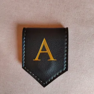 Black leather magnetic bookmark with gold letter A, stylish diamond memo clip for reading.