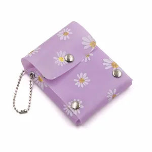 Purple daisy print mini lipstick pouch, translucent plastic coin purse with keychain chain.