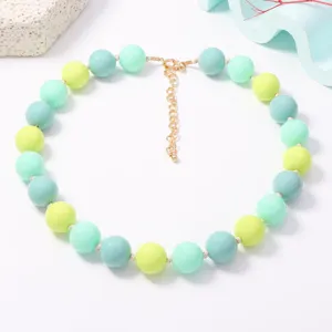 Detailed shot of colorful macaron beaded necklace, pastel round beads with adjustable chain.