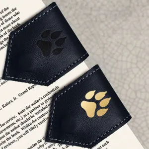 Leather corner bookmark with cute paw print design, perfect reading page marker tool.