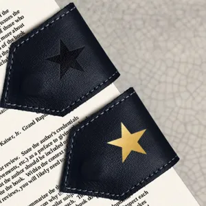 Black leather corner bookmarks with star designs, vintage page markers for reading books.