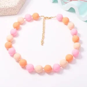 Close-up view of colorful macaron beaded necklace details, highlighting vibrant pastel hues.