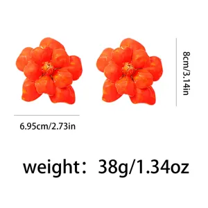 Detailed view of large orange flower statement earrings, highlighting dimensions and 38g weight.