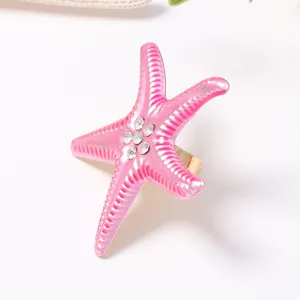 Pink gradient starfish open ring featuring sparkling crystal rhinestones for beach vacation style.