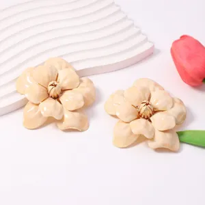Exquisite cream enamel flower earrings detailed with gold edges for elegant daily wear.