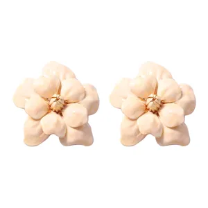 Exquisite floral detail shot showing the delicate camellia petal texture and gold stamen design.