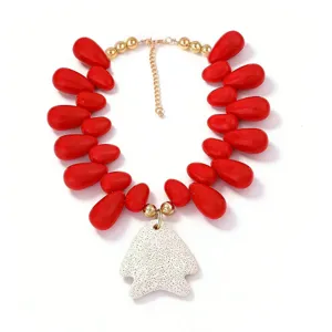 Red beaded statement necklace featuring a white volcanic stone pendant for beach vacation style.