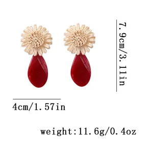 Chic raffia woven flower and red acrylic teardrop statement earrings for women vacation style.