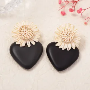Exaggerated raffia woven flower black heart acrylic earrings for chic fashion vacation style.