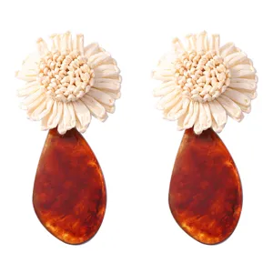 Exquisite raffia woven flower and amber acrylic teardrop earrings for stylish vacation wear.