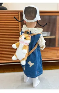 Cute plush cat backpack for kids, realistic simulation cat toy bag, soft and practical use.