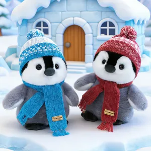 Cute plush penguin toy with knitted hat and scarf, winter warm desktop ornament gift.