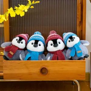 Cute cartoon penguin plush toys with knit hats and scarves, warm desktop decor gifts.
