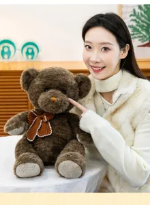 Detailed shot of cute brown teddy bear plush toy with knit bow tie, soft companion for girls.