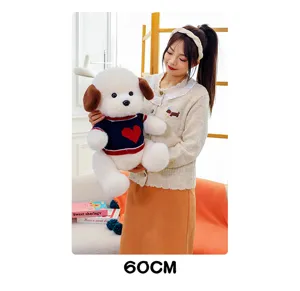 Detailed view of the cute plush puppy doll in a red heart knit sweater, soft toy showcase.