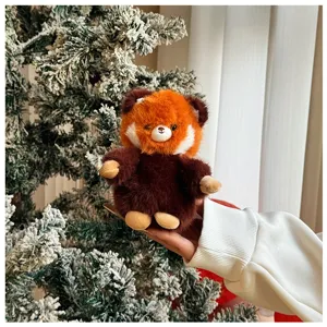 Fluffy red panda plush toy pendant, cute animal keychain for bag or car interior decor.