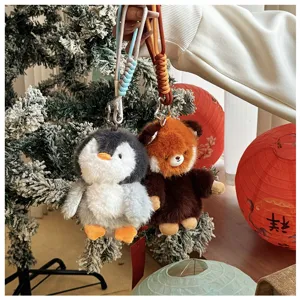 Cute plush penguin and panda animal keychains, soft stuffed toy pendants for car decor.