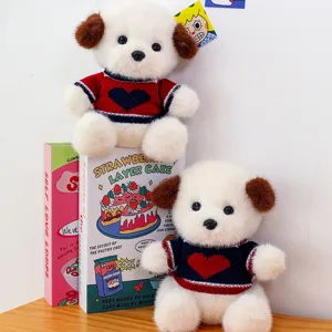 Cute plush puppy toy doll with knitted heart sweater, jointed doll for cute photography.