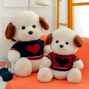 Cute plush dog stuffed animal toy wearing sweater with heart pattern, soft and cuddly gift.