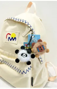 Cute cartoon plush animal keychain and bag pendant, soft furry doll charm for keys and backpacks.