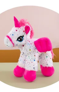 Detail view of the cute star-printed unicorn plush toy showing soft fabric and pink accents.