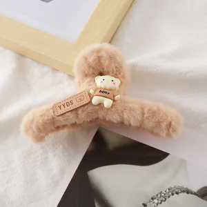 Autumn winter plush hair claw clip with cute bear and leather tag, cozy hair accessory.