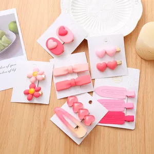 Ensemble de pinces à cheveux roses douces et mignonnes pinces bec de canard pour femmes.