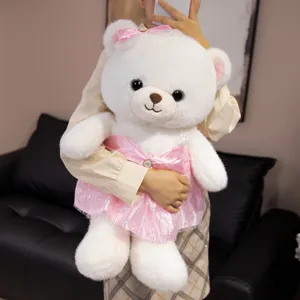 Cute white plush teddy bear doll wearing a pink wedding dress, perfect romantic gift.
