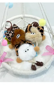 Cute cartoon fluffy plush ball keychain cute bag charm stylish accessory for keys and backpacks.