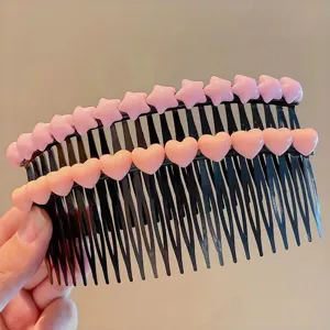 Children double row insert hair comb with cute pink star and heart decorations detail view