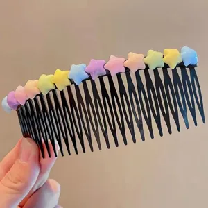 Detailed shot of kids colorful star hair comb, cute hair insert accessory for sweet styles.