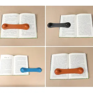 Weighted leather bookmark page holder for easy reading, stylish book weight clip tool.
