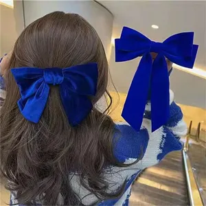 Blue velvet bow hair clip elegant fabric hair accessories sweet hair styling pin detail shot
