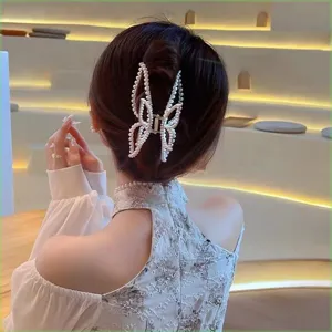 Pearl butterfly hair claw clip detail shot, elegant hairpin accessory for women and girls daily wear.