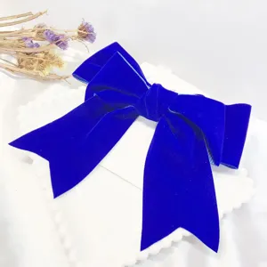 Stunning Klein blue velvet bow hair clip for women, elegant fabric duckbill hair accessory.