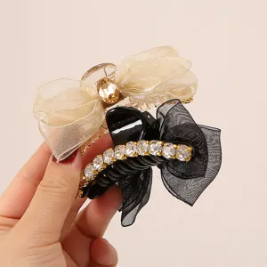 Elegant organza bow hair claw clips with sparkling rhinestones, fashionable hair accessories.
