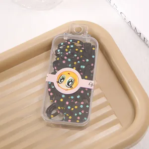 Kids elastic hair ties in clear storage box with cute cartoon design, durable and stretchy.