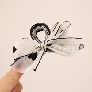 Elegant black and white organza bow hair claw clip with rhinestones and pearls for women